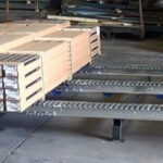 Split roller pallet flow rack with stands